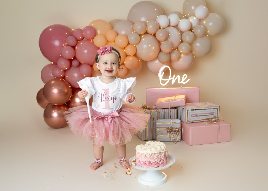 Studio-style blush pink cake smash setup in Sarasota