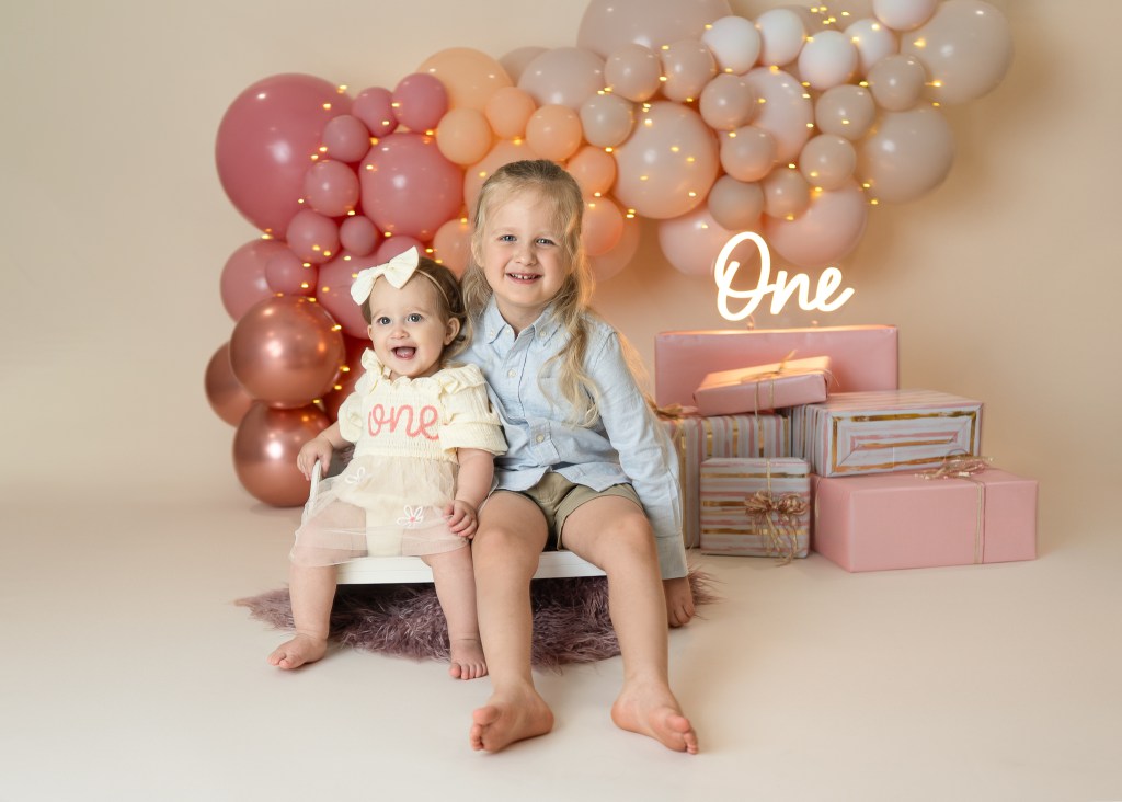 Sibling portraits during first birthday session in Sarasota