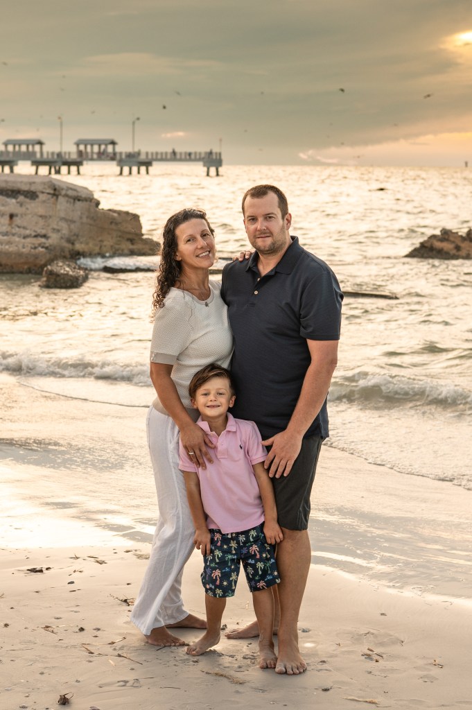 Family enjoying a Sarasota family photography session on the beach.