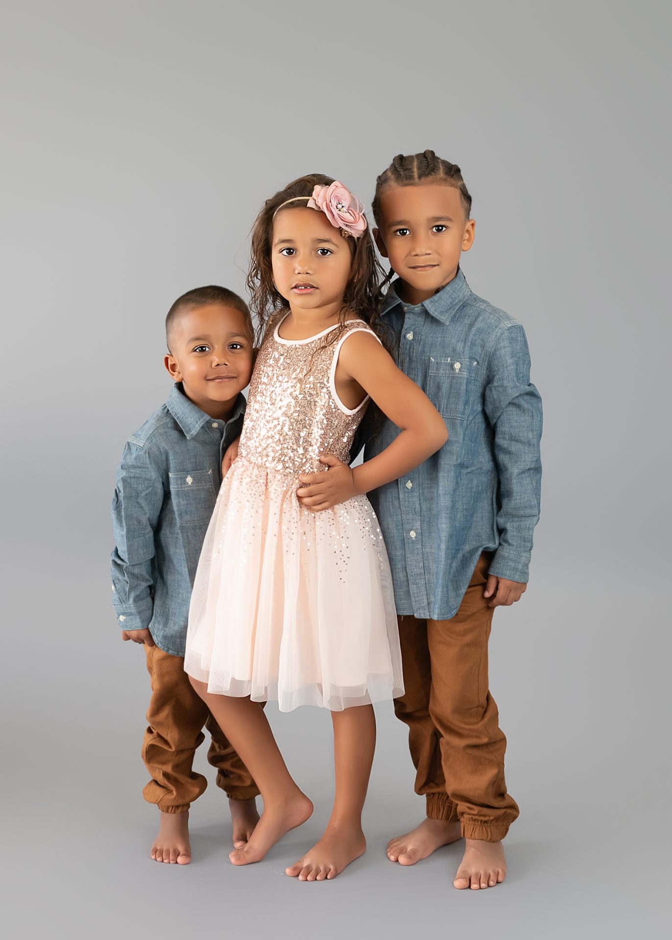 2 brothers posed with their sister